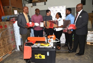 The National Environment and Planning Agency (NEPA) received a donation of hurricane relief items from the International Union for Conservation of Nature (IUCN) Caribbean to support protected-area workers and their families who have been affected by Hurricane Melissa. The handover took place on January 27 at BL Williams International Limited,  Newport West, Kingston. Participating in the handover (from left) are Deputy Chief Executive Officer, Environmental Management and Sustainability Division, NEPA, Anthony McKenzie; Botanist, Natural History Museum of Jamaica, Institute of Jamaica (IOJ), Keron Campbell; Safety and Security Coordinator, Para la Naturaleza, Manuel Mercado Martin; Community Development Officer, Caribbean Coastal Area Management Foundation, Claudine Townsend; Conservation Science Officer, Jamaica Conservation and Development Trust (JCDT), Shane Brown; and Director, Planning, Projects, Monitoring, Evaluation and Research Division, NEPA, Ainsworth Carroll. 

