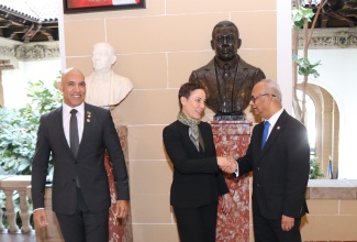 Minister of Foreign Affairs and Foreign Trade, Senator the Hon. Kamina Johnson Smith (centre), receives a warm welcome from Secretary General of the Organization of American States (OAS) Ambassador Albert Ramdin, as she arrives at the OAS headquarters in Washington DC on Monday (February 2) to attend the consultative meeting on Haiti’s security, governance and electoral pathway. At left is Jamaica