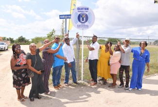 Managing Director of the Universal Service Fund (USF), Charlton McFarlane (fifth right); Member of Parliament (MP) for St. Catherine Southern, Fitz Jackson (fifth left); and Councillor for the Greater Portmore North Division, Gary Nicholson (fourth left), join community stakeholders at the launch of the Community Wi-Fi in Clifton in Portmore, St. Catherine, in February 2025.

