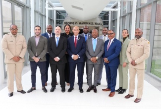Jamaica's Ambassador to the United States, His Excellency Major General (Ret'd) Antony Anderson (centre), shares a photo opportunity with representatives of the National Defense University in Washington DC and officers from  the Jamaica Constabulary Force (JCF) and  the Jamaica Defence Force (JDF) following their graduation from  a two-week Caribbean Security and Defense Course at the institution's  William J. Perry Center for Hemispheric Defense Studies.
