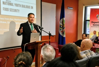Minister of Water, Environment and Climate Change, Hon. Matthew Samuda, delivers the keynote address at the national youth dialogue on food security held at the University of the West Indies