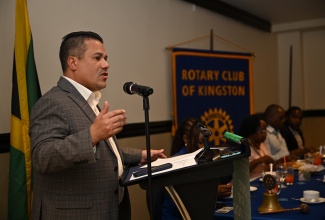 Minister of Water, Environment and Climate Change, Hon. Matthew Samuda, delivers a presentation on the topic 
