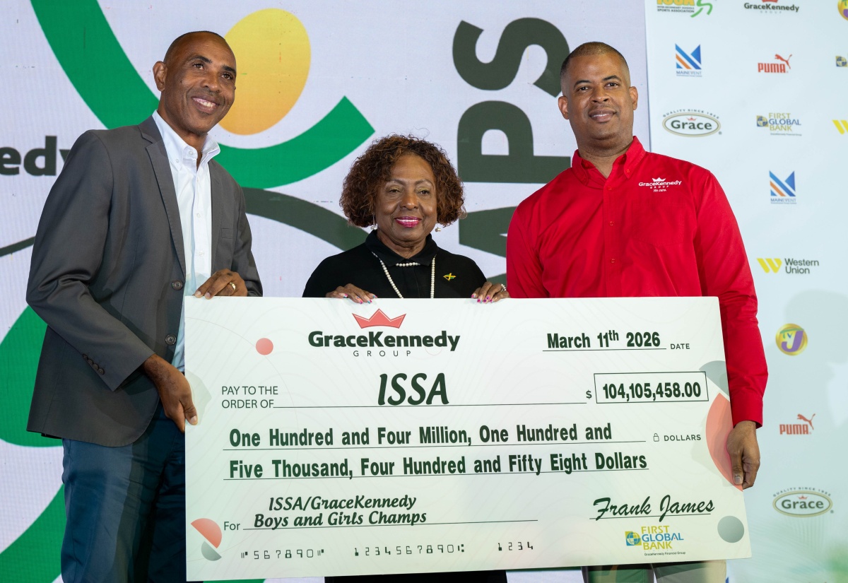 Minister of Culture, Gender, Entertainment and Sport, Hon. Olivia Grange (centre), shares the lens with Chief Executive Officer of GraceKennedy Group, Frank James (right), and President of the Inter-Secondary Schools Sports Association (ISSA), Keith Wellington, during the handover of a symbolic sponsorship cheque at the official launch of the 2026 ISSA/GraceKennedy Boys and Girls’ Athletics Championships at the National Arena in Kingston, on Wednesday (March 11).

