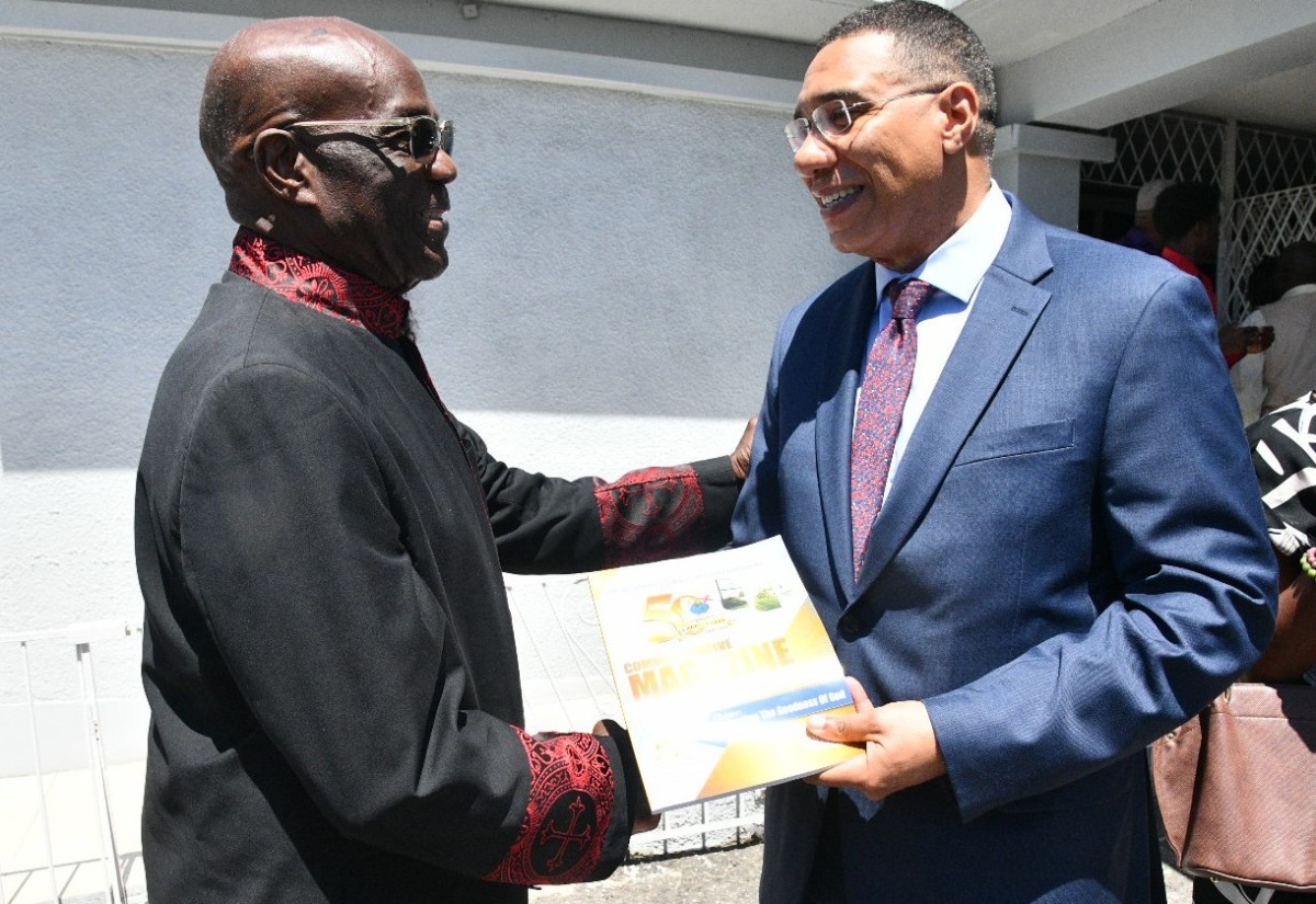 Prime Minister, Dr. the Most Hon. Andrew Holness (right), is greeted by Bishop Dr. Herro Blair at the Faith Cathedral Deliverance Centre in Kingston on Sunday (March 22). Dr. Holness delivered greetings at the 50th anniversary celebrations of the Deliverance Evangelistic Association.

