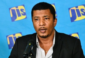 Principal Director in the Agricultural Marketing Information and Incentives Branch (AMIIB), Ministry of Agriculture, Fisheries and Mining,  Kevin Condappa, addresses a JIS Think Tank on March 20 at the agency