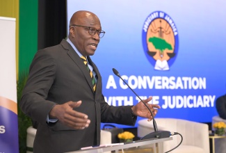 Chief Justice, Bryan Sykes, addresses a recent forum, dubbed