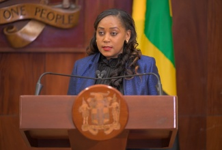 Senior Judge of the Corporate Area Traffic Court, Her Honour Mitsy Beaumont-Daley, addresses a post-Cabinet press briefing at Jamaica House on Wednesday (March 25).

