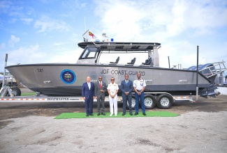 Chief of Defence Staff, Vice Admiral Antonette Wemyss-Gorman (centre), shares a photo opportunity with (from left) Senior Vice President, Metal Shark, Henry Irizarry; Permanent Secretary in the Office of the Prime Minister, Ambassador Rocky Meade; Commissioner of Police, Dr. Kevin Blake;  and Brigade Commander, Maritime, Air and Cyber Command, Brigadier Elon Clarke, in front of one of the newly acquired high-speed Surface Interceptor Vessels during a blessing ceremony at the Jamaica Defence Force Coast Guard, Port Royal, Kingston, on March 18.

