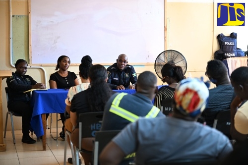 New Commanding Officer for the Morant Bay Division, Deputy Superintendent (DSP) Rohan Ritchie (seated, right) convenes a meeting at the Morant Bay Police Station with event promoters on Wednesday (February 25).