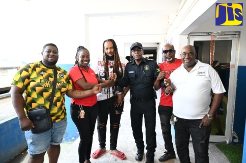 New Commanding Officer for the Morant Bay Division, Deputy Superintendent (DSP) Rohan Ritchie (third right) pauses for a photo opportunity with event promoters and entertainment industry stakeholders in St. Thomas following a meeting on February 25. From left are: Promoter, Andrew Pang; Diona Campbell from J Wray and Nephew; Entertainer, Rani RastaCiti; Promoter, Wayne Levy; and Businessman and Event Organiser, Dave Goldson.