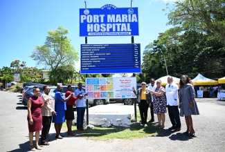 Minister of State in the Ministry of Health and Wellness, Hon. Krystal Lee (fifth right), and other officials unveil the certification of Port Maria Hospital as a Baby-Friendly facility during a ceremony on March 13.
