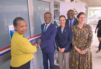 Minister of Foreign Affairs and Foreign Trade, Senator the Hon. Kamina Johnson Smith (centre), and Parliamentary Secretary in the Ministry of Education, Skills, Youth and Information, Senator Marlon Morgan (second right), participate in the official opening of Alliance Française de la Jamaïque's new location at the Technology Innovation Centre (TIC) on the University of Technology (UTech) campus in Papine, St. Andrew, on March 20.  Cutting the ribbon (from left) are President of Alliance Française, Jamaica, Mylène Ferriera, and President of UTech, Dr. Kevin Brown, while Ambassador of France to Jamaica, Her Excellency Marianne Ziss, looks on.

