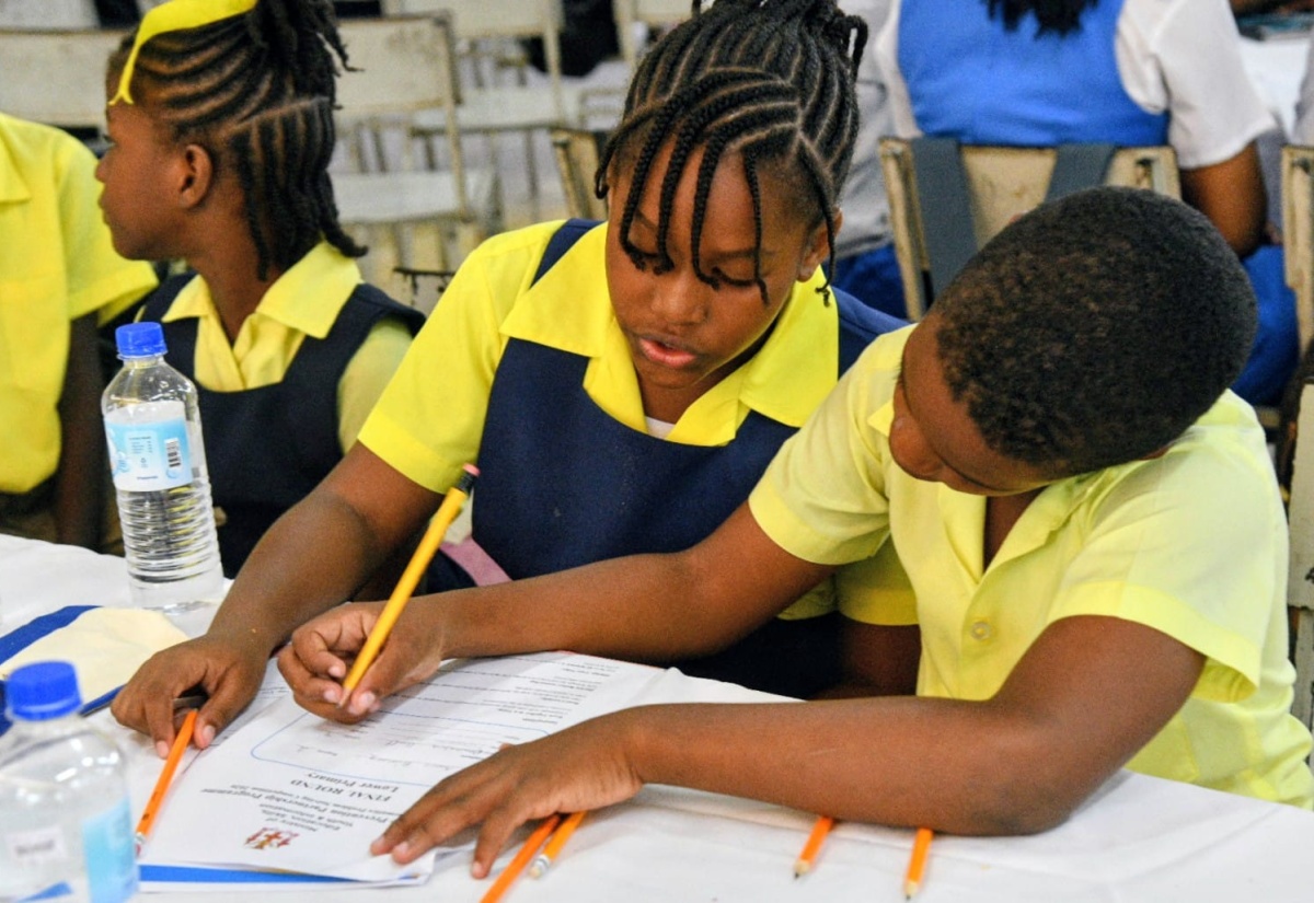 Students of Green Island Primary School participate in solving equations during the 2026 Mathematics Problem-Solving Competition finale, held on March 12 at Merl Grove High School in Kingston.