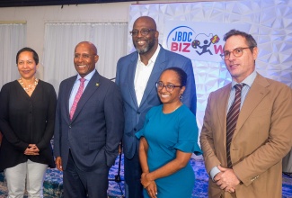 Minister of Industry, Investment and Commerce, Senator the Hon. Aubyn Hill (second left), pauses for a photo opportunity with (from left) Resident Representative of the Organization of American States (OAS), Jeanelle van GlaanenWeygel; Acting Chief Executive Officer of the Jamaica Business Development Corporation (JBDC), Harold Davis; President of Jamaica Promotions Corporation (JAMPRO), Shullette Cox; and Deputy Head of Cooperation at the European Union (EU) Delegation to Jamaica, Belize, The Bahamas, Turks and Caicos and the Cayman Islands, Koenraad Burie, following the launch of the JBDC Biz Wiz online learning platform at The Jamaica Pegasus hotel on March 5.