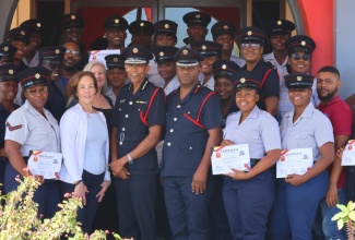 Commissioner, Jamaica Fire Brigade (JFB), Stewart Beckford (fourth left, front row), and Assistant Commissioner, Andrew Russell (fifth left), share a photo opportunity with the first cohort of Emergency Telecommunicators, along with facilitators of the Emergency Telecommunicator Training Programme, following the graduation ceremony in February.

