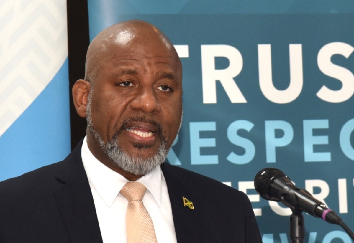 Director General of the Planning Institute of Jamaica (PIOJ), Dr. Wayne Henry (centre), addresses the agency’s quarterly hybrid media briefing on Tuesday (March 3).

