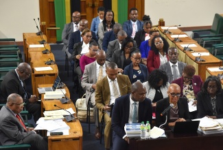 Minister of Finance and the Public Service, Hon. Fayval Williams (centre), addressing the meeting of the Standing Finance Committee on Thursday (March 5) at Gordon House.  She is flanked by State Minister in the Ministry of Finance and the Public Service, Hon. Zavia Mayne (left), and Financial Secretary, Darlene Morrison. 

