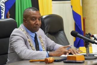 Mayor of Kingston, Councillor Andrew Swaby, addresses the monthly meeting of the Kingston and St. Andrew Municipal Corporation (KSAMC) held recently at the Corporation’s downtown Kingston offices.

