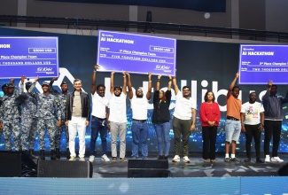 Minister without Portfolio in the Office of the Prime Minister responsible for Efficiency, Innovation and Digital Transformation, Ambassador the Hon. Audrey Marks (sixth right), and Founder of Intellibus, Ed Watal (eighth left), share lens with the top three teams in the Intellibus Artificial Intelligence (Al) Hackathon. The awards ceremony was held on Sunday (March 15) at the National Arena in Kingston, on Sunday (March 15). 


