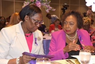 Minister of Culture, Gender, Entertainment and Sport, Hon. Olivia Grange (right), with Principal Director at the Bureau of Gender Affairs (BGA), Sharon Coburn Robinson, during a ceremony commemorating the International Day for the Elimination of Violence Against Women (IDEVAW) in February 2026.
