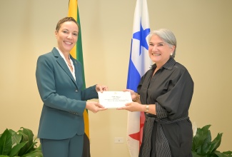 Minister of Foreign Affairs and Foreign Trade, Senator the Hon. Kamina Johnson Smith (left), receives Letters of Credence from Ambassador-designate of the Republic of Panama to Jamaica, Her Excellency Elida Alcedo de Arosemena, at the Ministry’s offices in downtown Kingston on Tuesday (March 17).

