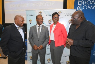 Executive Director of the Broadcasting Commission of Jamaica, Cordel Green (right), is in conversation with (from left) Lead Researcher and Professor of Information Systems at the College of Business and Management (COBAM), University of Technology (UTech), Jamaica, Professor Paul Golding; President of UTech, Dr. Kevin Brown;  Lecturer at the COBAM, Camille Jackson. Occasion was the recent launch of the 2025 Teen and Tech Report, at the UTech campus in St. Andrew.
