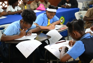 Students participate in Round one of the Portland Primary Mathematics Quiz Competition, at the Buff Bay Primary School on March 18.

