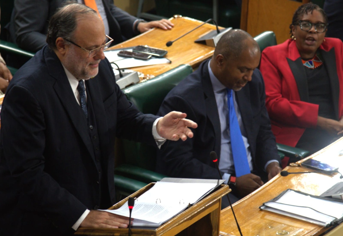 Leader of the Opposition,  Mark Golding (left), delivers his contribution to the 2026/2027 Budget Debate in the House of Representatives, yesterday (March 17). Also pictured are Opposition Spokesman on Finance, Planning, and the Public Service, Julian Robinson (centre), and Opposition Spokesperson for Social Protection and Social Transformation, Dr. Angela Brown-Burke.

