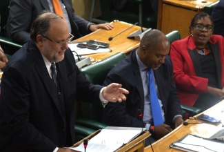 Leader of the Opposition, Mark Golding (left), delivers his contribution to the 2026/2027 Budget Debate in the House of Representatives, yesterday (March 17). Also pictured are Opposition Spokesman on Finance, Planning, and the Public Service, Julian Robinson (centre), and Opposition Spokesperson for Social Protection and Social Transformation, Dr. Angela Brown-Burke.