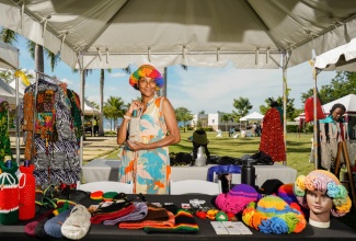 A local artisan proudly displays her products during a previous staging of the Tourism Product Development Company (TPDCo) ‘Craft with a Difference’ event.

