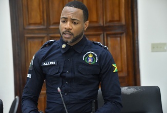 Operations Officer for the Westmoreland Division, Deputy Superintendent of Police (DSP) Jordaine Allen, gives remarks during the recent monthly meeting of the Westmoreland Municipal Corporation in Savanna-la-Mar.

