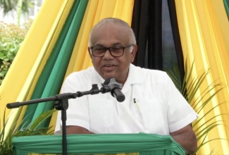 Custos Rotulorum for the parish of St. Mary, Hon. Errol Johnson, gives his address during a ceremony to commemorate Chief Takyi Day at Claude Stuart Park in Port Maria on April 8.  
