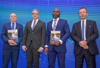Minister Without Portfolio in the Office of the Prime Minister with Responsibility for Science, Technology and Special Projects, Dr. the Hon. Andrew Wheatley (second right), shares the lens with (from left) Regional Director and Representative of the United Nations Educational, Scientific and Cultural Organization (UNESCO) Regional Office for the Caribbean, Eric Falt; Director General of UNESCO, Professor Khaled El-Enany; and Head of Cooperation for the Delegation of the European Union (EU) to Jamaica, Aniceto Rodriguez Ruiz. The occasion was the presentation of Jamaica’s AI Readiness Assessment Methodology (RAM) Report, launched on Wednesday (April 1) at Jamaica House. The assessment was completed in partnership with UNESCO, with funding support from the EU.
