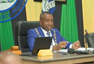 Mayor of Kingston, Councillor Andrew Swaby, addresses the Kingston and St. Andrew Municipal Corporation’s Monthly Sitting of Council on Tuesday (April 14) at the Corporation