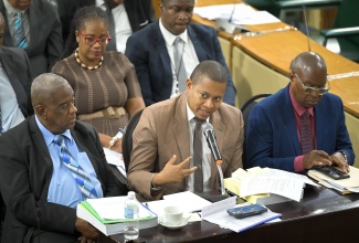 Minister of Agriculture, Fisheries and Mining, Hon. Floyd Green, is flanked by State Minister, Hon. Franklin Witter (left), and Permanent Secretary, Dermon Spence (right), as he addresses the Standing Finance Committee of the House of Representatives, during its review of the 2026/27 Estimates of Expenditure at Gordon House on March 6.

