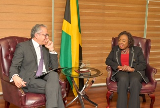 Minister of Culture, Gender, Entertainment and Sport, Hon. Olivia Grange (right), engages in discussion with United Nations Educational, Scientific and Cultural Organisation (UNESCO) Director General, Khaled El-Enany (left) at the Ministry’s New Kingston offices on Thursday (April 2).