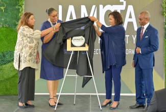 Minister without Portfolio in the Office of the Prime Minister responsible for Efficiency, Innovation and Digital Transformation, Hon. Ambassador Audrey Marks (third left), unveils the logo of the Information and Communications Technology (ICT) Authority, during a media launch at its Old Hope Road offices on Friday (April 10). Sharing in the unveiling (from left) are Chair of the ICT Authority Board, Professor Gunjan Mansingh; ICT Authority Chief Information Officer, Anika Shuttleworth; and Permanent Secretary in the Office of the Prime Minister, Ambassador Dr. Rocky Meade.

