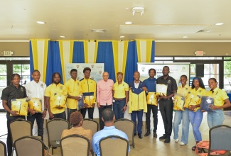 President of the University of Technology (UTech), Jamaica, Dr. Kevin Brown (sixth right); Pro-Chancellor, UTech, Aldrick McNab (sixth left); and Strategic Lead, Sports Development and Integration, UTech, Professor Kamilah Hylton (seventh right), pose for a photo with student athletes showcasing their track and field gear. The occasion was a media briefing and official send-off for athletes bound for the Penn Relays, held on Friday (April 17) at the University’s main campus in Papine, St. Andrew. The meet, in its 130th staging, will be held from April 23–25, 2026, at Franklin Field in Philadelphia.