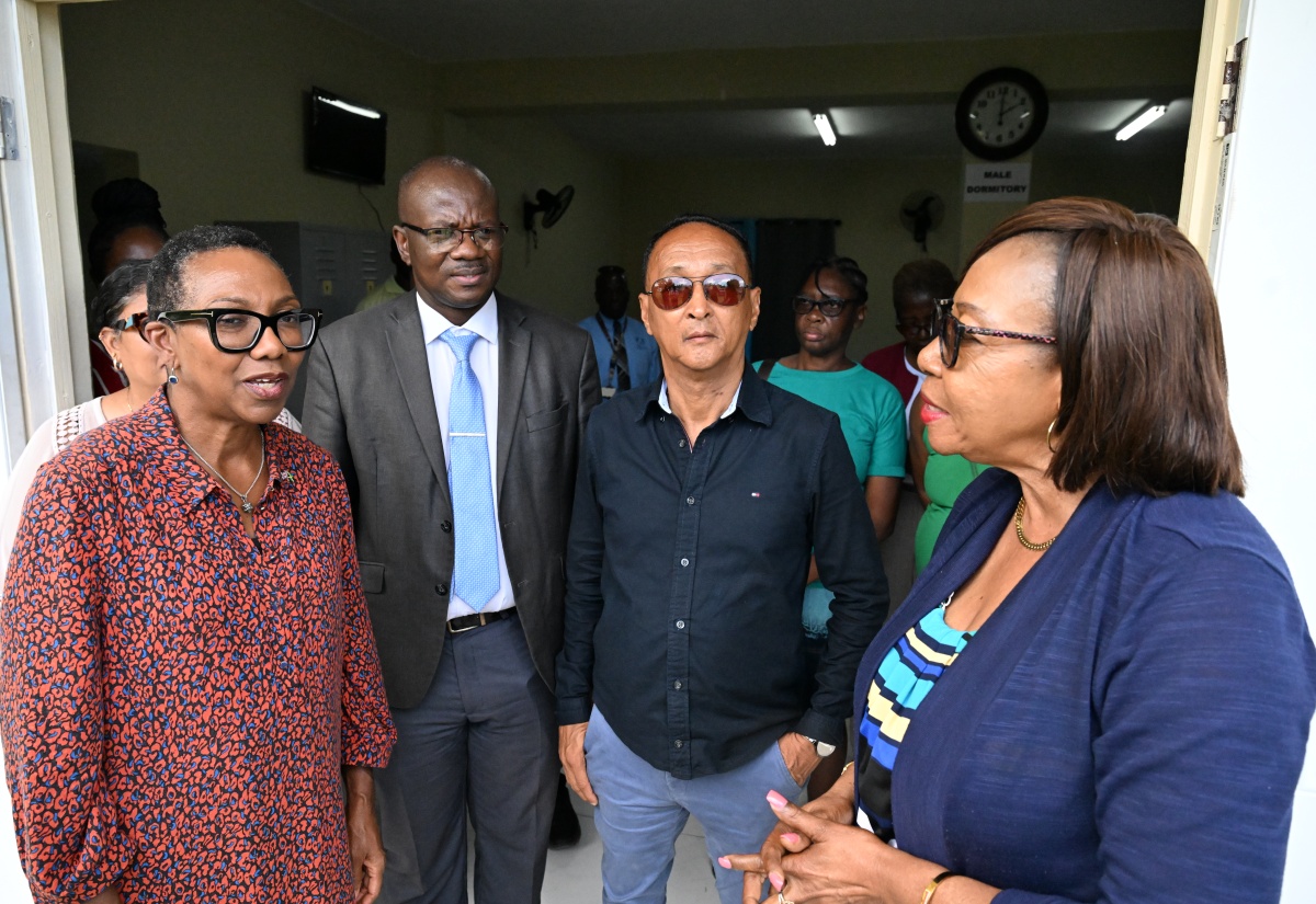 British High Commissioner to Jamaica, Her Excellency Alicia Herbert (left), shares a moment with (from second left) Chief Executive Officer for the St. Thomas Municipal Corporation, Kevin McIndoe; Mayor of Morant Bay, Councillor Louis Chin; and Member of Parliament for St. Thomas Eastern, Yvonne Rosemarie Shaw, during a tour of the newly opened night shelter in the parish capital, Morant Bay, on April 23. 
