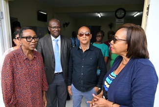 British High Commissioner to Jamaica, Her Excellency Alicia Herbert (left), shares a moment with (from second left) Chief Executive Officer for the St. Thomas Municipal Corporation, Kevin McIndoe; Mayor of Morant Bay, Councillor Louis Chin; and Member of Parliament for St. Thomas Eastern, Yvonne Rosemarie Shaw, during a tour of the newly opened night shelter in the parish capital, Morant Bay, on April 23. 
