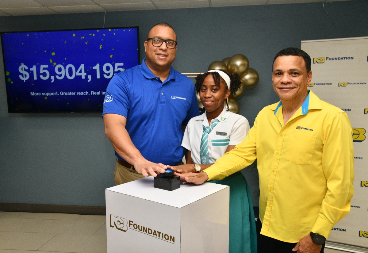 Chief Executive Officer of the National Commercial Bank (NCB) Foundation, Perrin Gayle (left), Deputy Chair of the NCB Foundation, Andrew Pairman (right), and student of Denbigh High School, Javannae Garwood, press the buzzer to reveal the amount handed over to the Overseas Examination Commission for the 2026 Caribbean Secondary Education Certificate (CSEC) National Bursary Programme. The handover ceremony was held at NCB Atrium in Kingston on Friday (April 17).