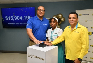 Chief Executive Officer of the National Commercial Bank (NCB) Foundation, Perrin Gayle (left), Deputy Chair of the NCB Foundation, Andrew Pairman (right), and student of Denbigh High School, Javannae Garwood, press the buzzer to reveal the amount handed over to the Overseas Examination Commission for the 2026 Caribbean Secondary Education Certificate (CSEC) National Bursary Programme. The handover ceremony was held at NCB Atrium in Kingston on Friday (April 17).