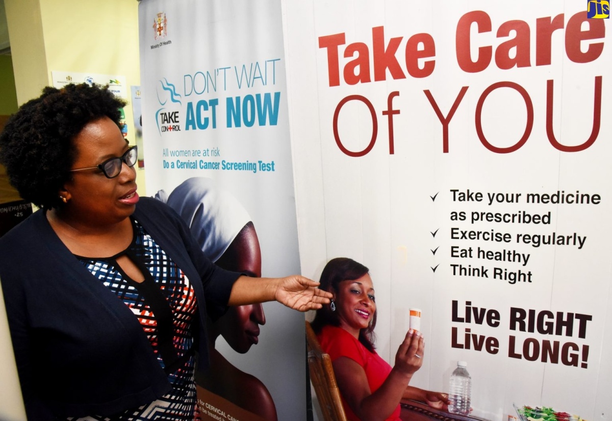 Director of Non-Communicable Diseases and Injuries Prevention, Ministry of Health and Wellness, Dr. Tamu Davidson, points to a health promotion flyer during a recent interview with JIS News at her New Kingston offices.
