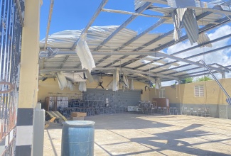 Hurricane-damaged roof of the auditorium at Black River High School.

