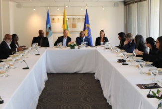 Tourism Minister, Hon. Edmund Bartlett (second right, head table), addresses members of the Inter-American Development Bank (IDB) Board during a luncheon hosted in his honour following his meeting with members of the IDB Board of Directors in Washington DC, on Tuesday (April 7). Others at the head table (from left) are Executive Director of the Global Tourism Resilience and Crisis Management Centre (GTRCMC), Professor Lloyd Waller; Executive Vice President of the IDB, Jordan Schwartz; and Director of Tourism Trade and International Relations in the Tourism Ministry, Christina Edwards.
