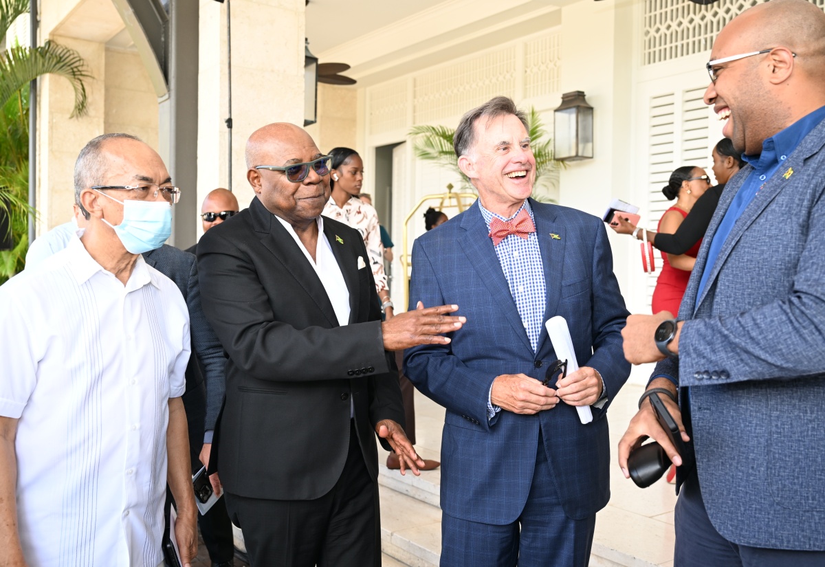 Minister of Tourism, Hon. Edmund Bartlett (second left), interacts with (from left) Deputy Prime Minister and Minister of National Security, Hon. Dr. Horace Chang; Half Moon Chairman, Guy Steuart; and Minister of State in the Ministry of Industry, Investment and Commerce, Hon. Delano Seiveright at the reopening of Eclipse at Half Moon in Rose Hall, St. James, on  April 2.