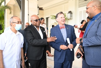 Minister of Tourism, Hon. Edmund Bartlett (second left), interacts with (from left) Deputy Prime Minister and Minister of National Security, Hon. Dr. Horace Chang; Half Moon Chairman, Guy Steuart; and Minister of State in the Ministry of Industry, Investment and Commerce, Hon. Delano Seiveright at the reopening of Eclipse at Half Moon in Rose Hall, St. James, on  April 2.