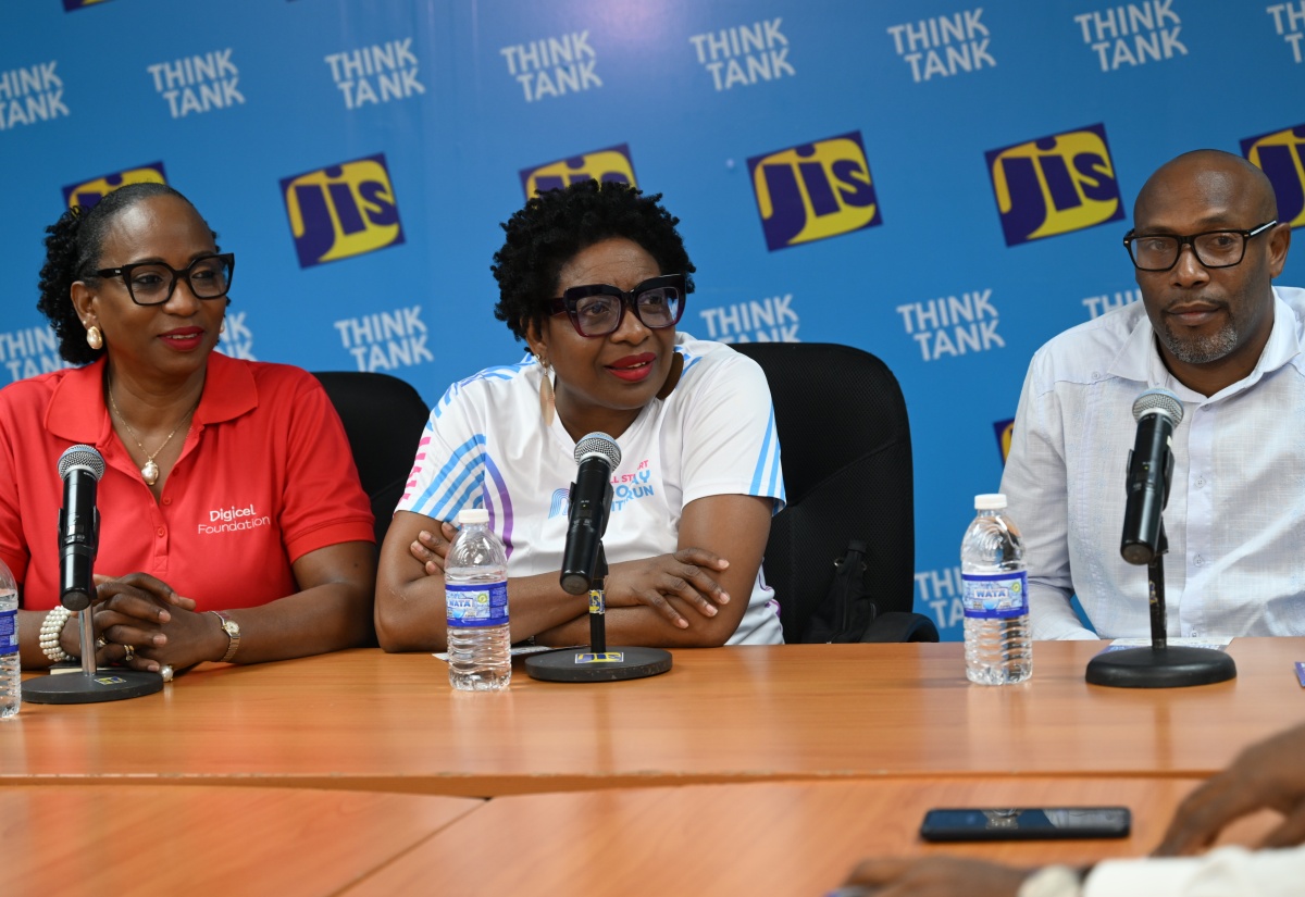 Chairman of Jill Stewart MoBay City Run, Janet Silvera (centre), addresses a Jamaica Information Service (JIS) 