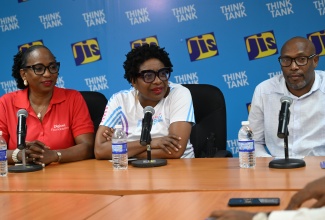 Chairman of Jill Stewart MoBay City Run, Janet Silvera (centre), addresses a Jamaica Information Service (JIS) 