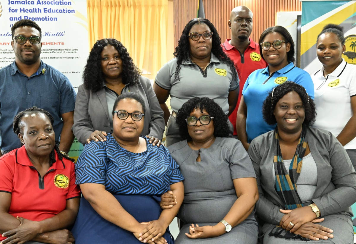 Newly elected president of the Jamaica Association of Health Education and Promotion (JAHEP), Dahlia Gayle Reid (second left, seated) shares a moment with the new executive during the organisation